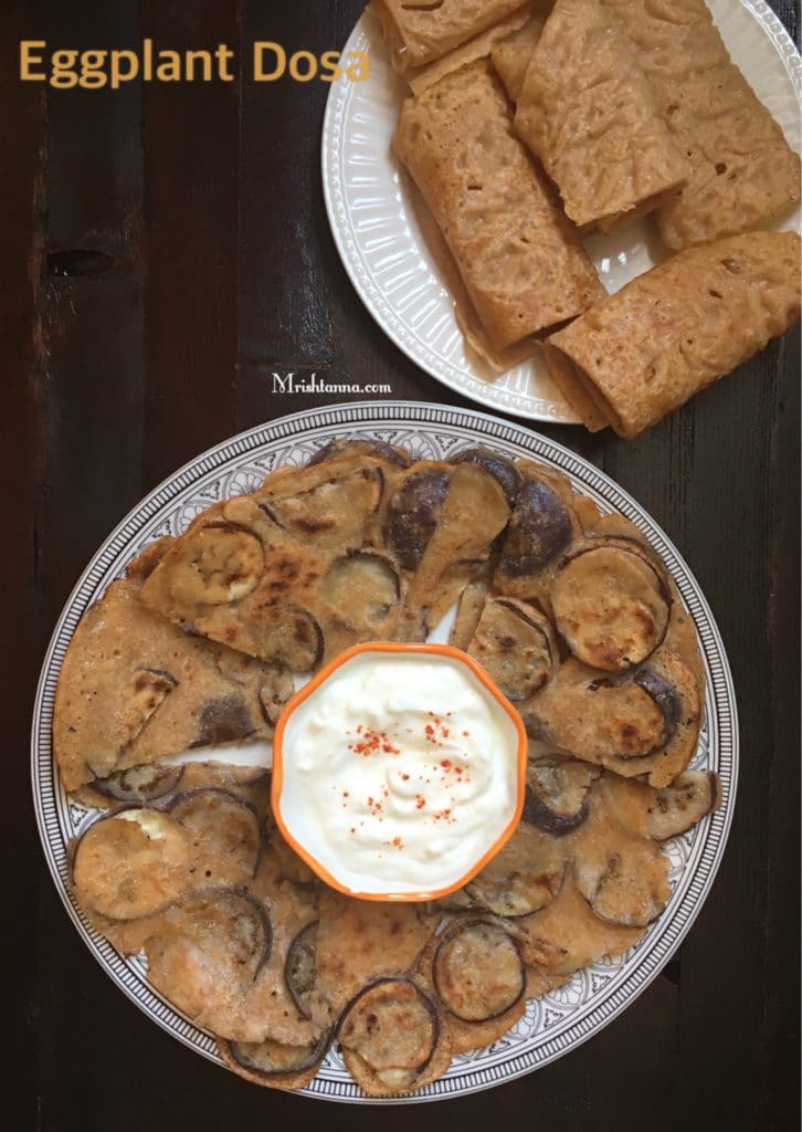 A plate of Eggplant Dosa along with raita is on the table