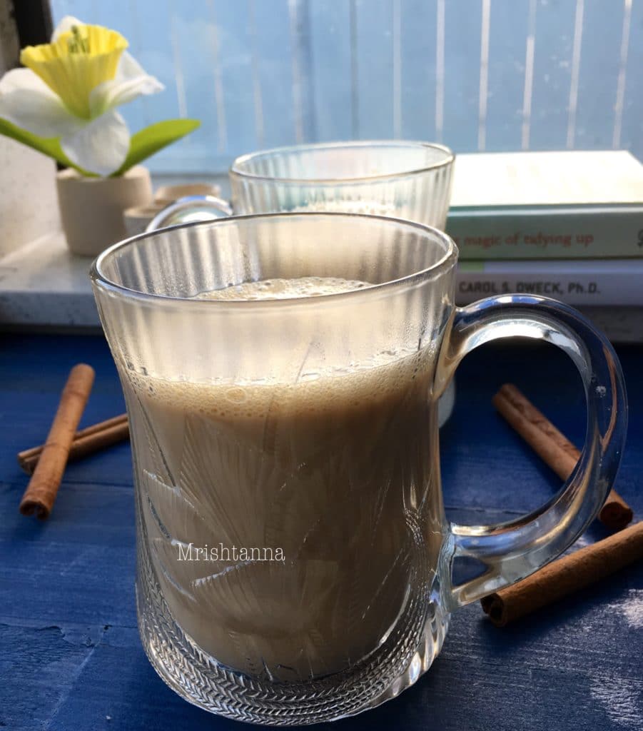 A glass of soy milk chai on the table
