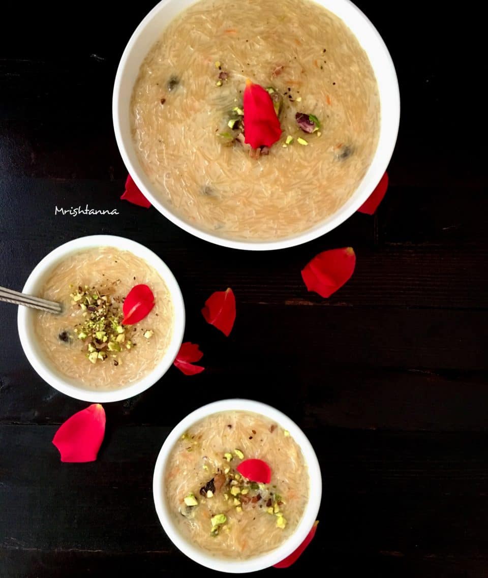 A bowl of food on a plate, with Kheer