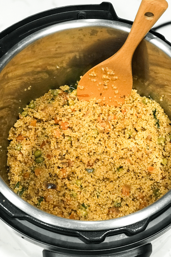 A pan filled with food, with Quinoa and Brown rice