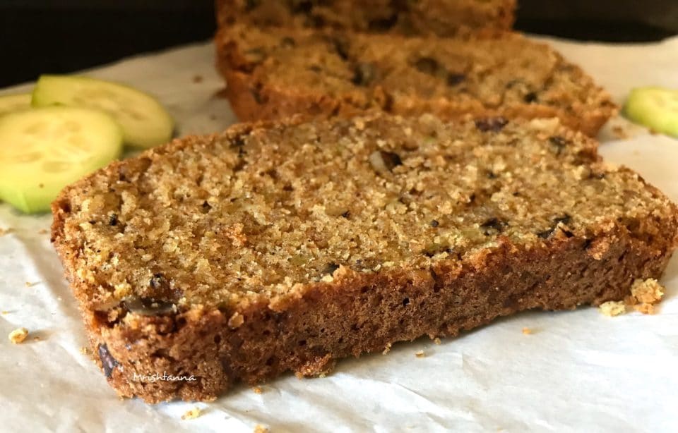 A close up of a slice of cake on a plate, with Bread and Walnut