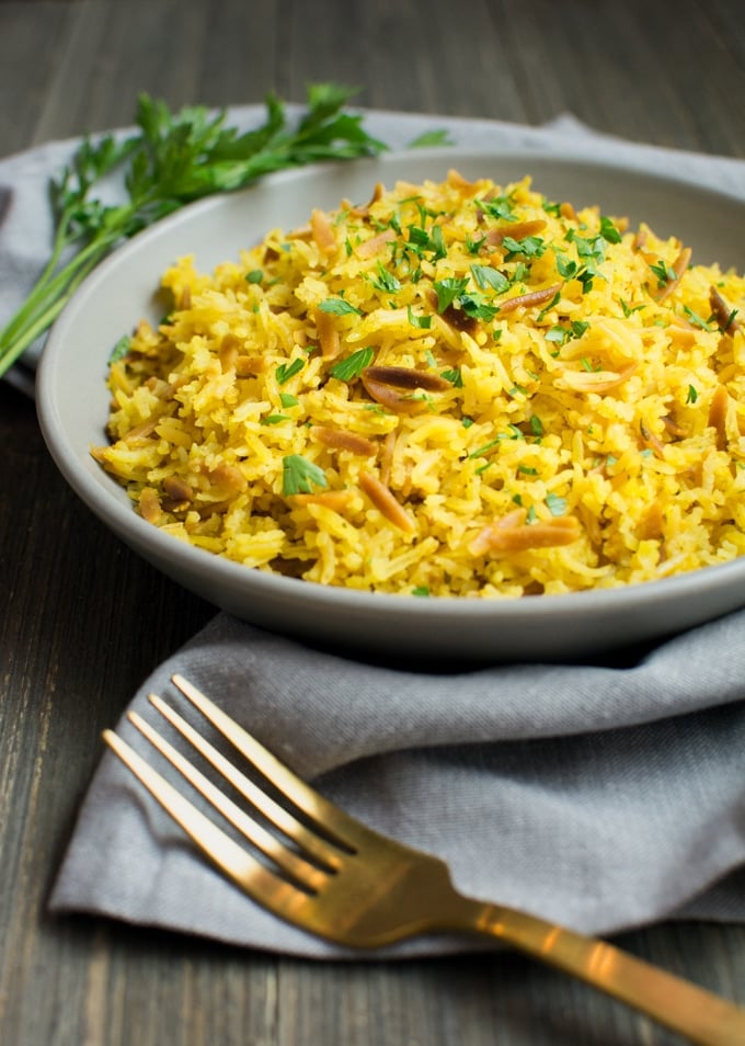 A plate of food with rice and vegetables, with Pilaf and Basmati