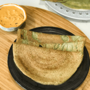 A plate of food on a table, with Dosa