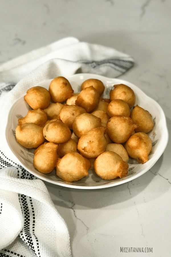 A close up of food, with Bonda and Dal