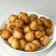 A plate with urad dal bonda on the table