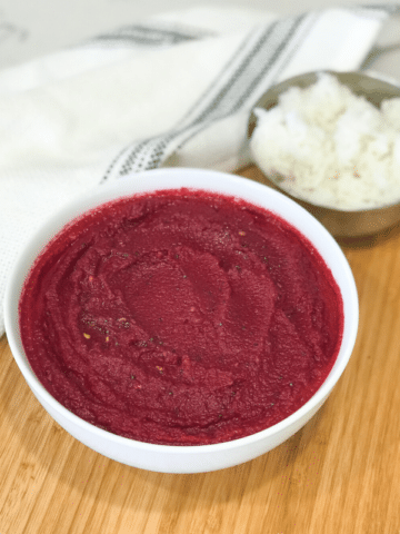 A close up of a bowl of beetroot chutney