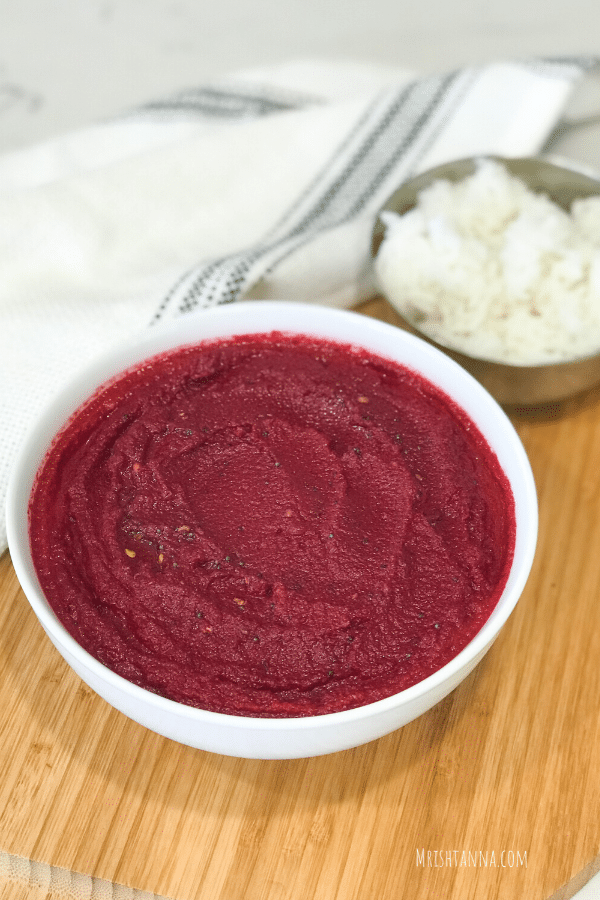 A close up of a bowl of beetroot chutney