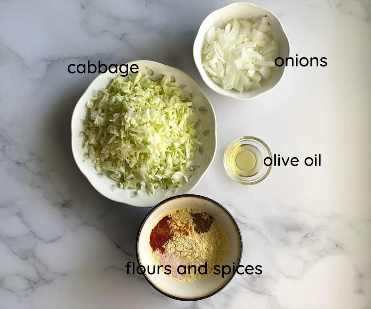 A surface is with air fryer cabbage pakora ingredients.