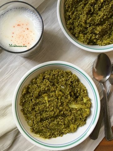 A bowl of spinach quinoa and with glass of butter milk