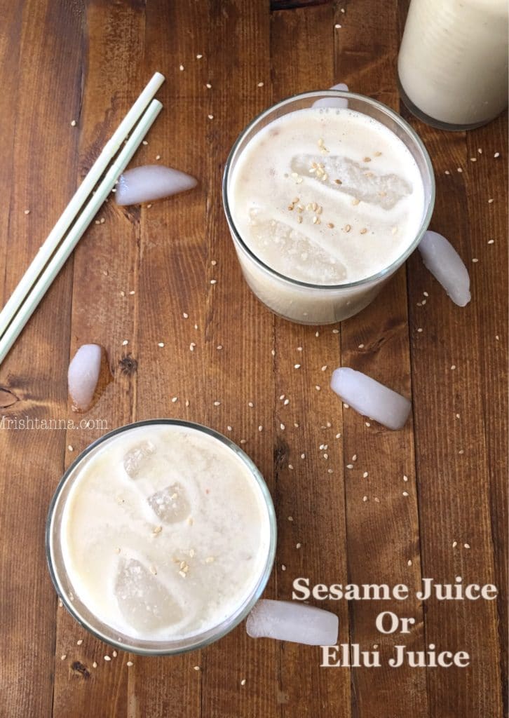 two cups of sesame juice on a wooden table.