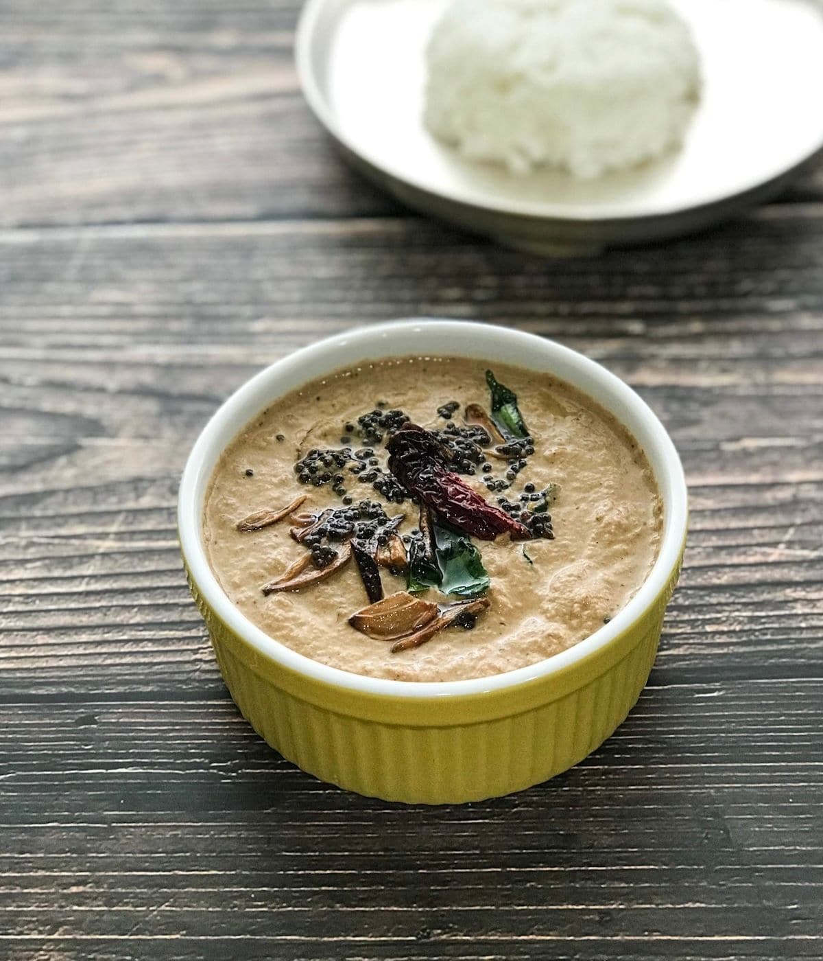 A bowl of banana blossom chutney is on the table