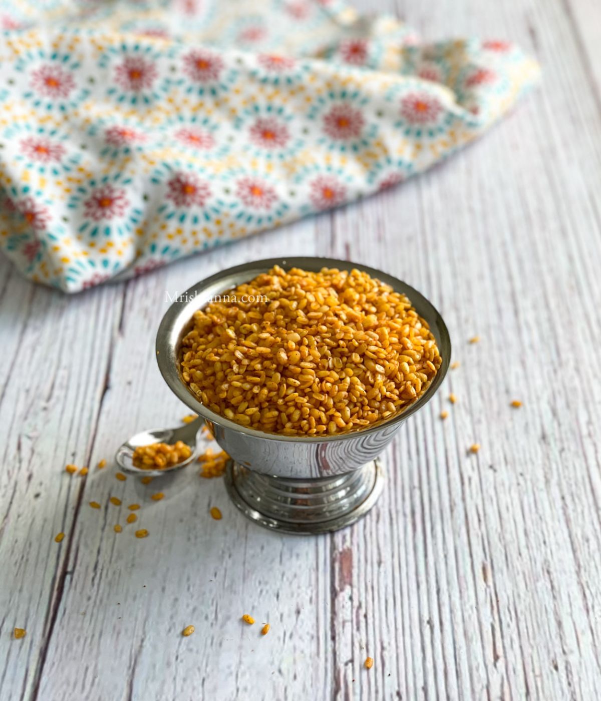 A bowl of air fryer moong dal namkeen is on the table.