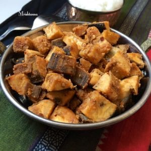 A bowl of plantain stir fry on the cotton napkins