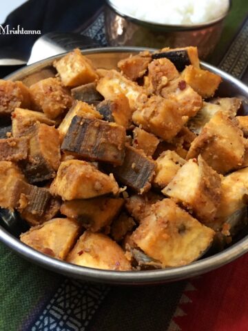 A bowl of plantain stir fry on the cotton napkins