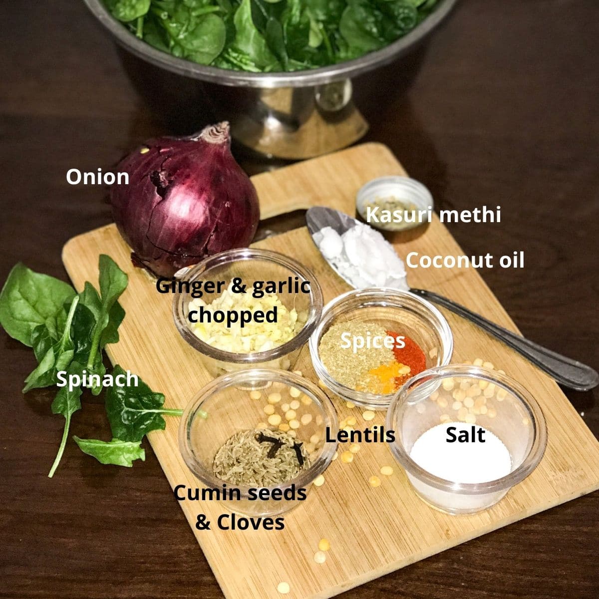 all the ingredients are placed on the table for spinach dal