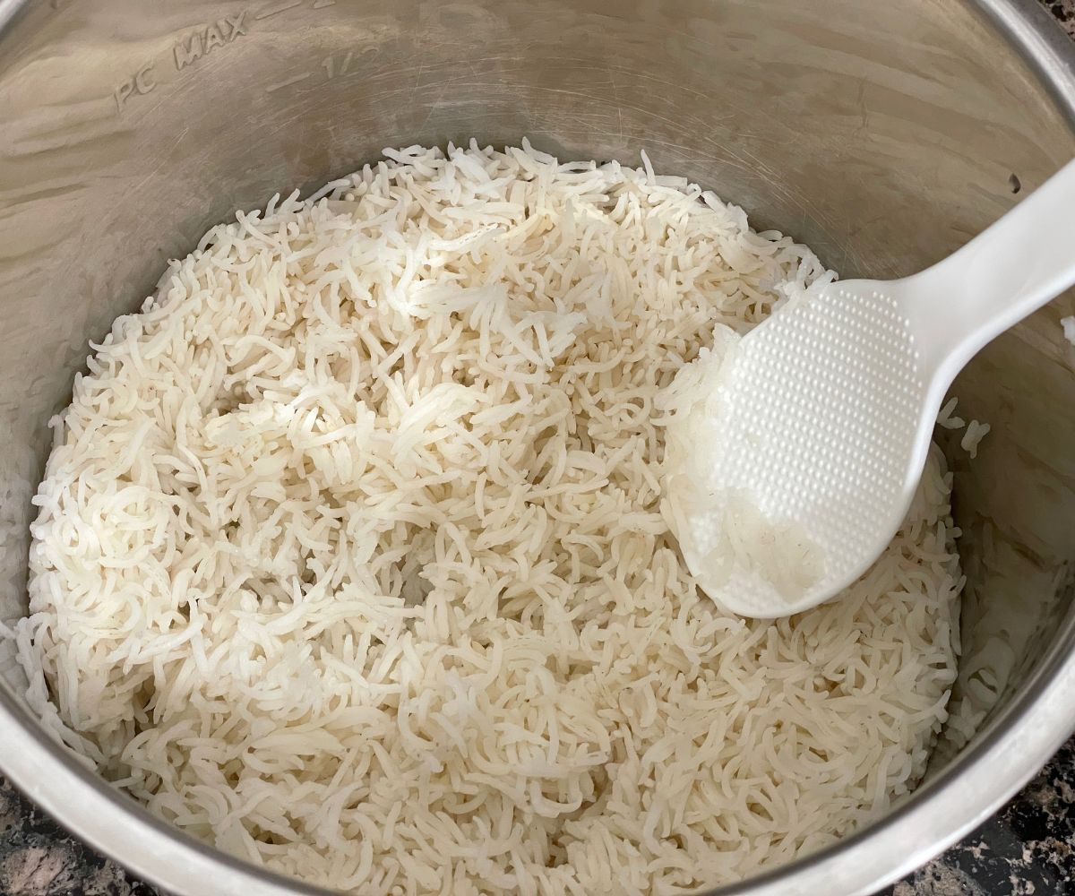 The cooked basmati rice is inside the instant pot.