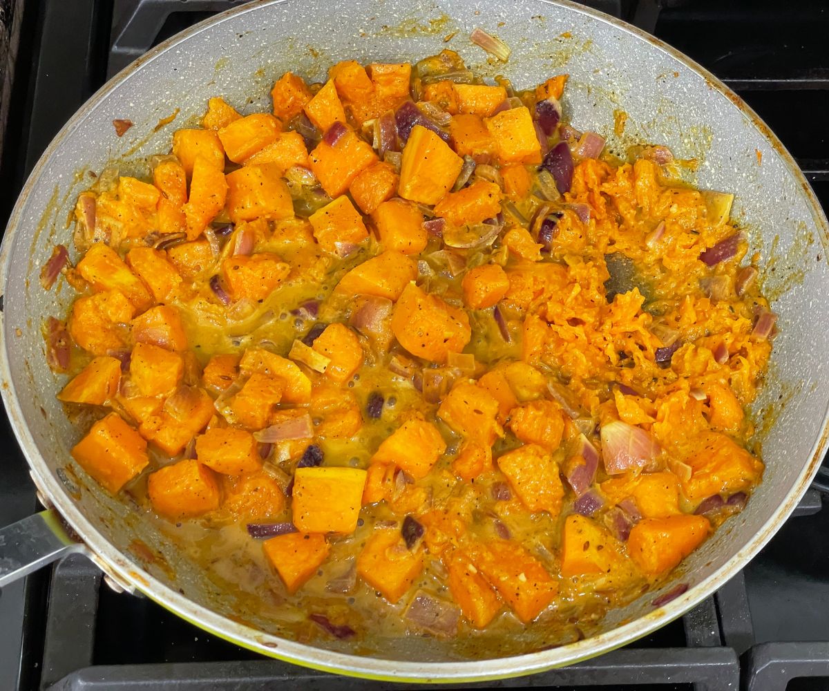 A pan is with pumpkin mixture for rice.