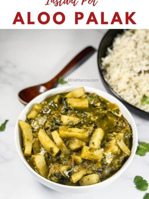 A bowl of spinach potato curry is on the table.