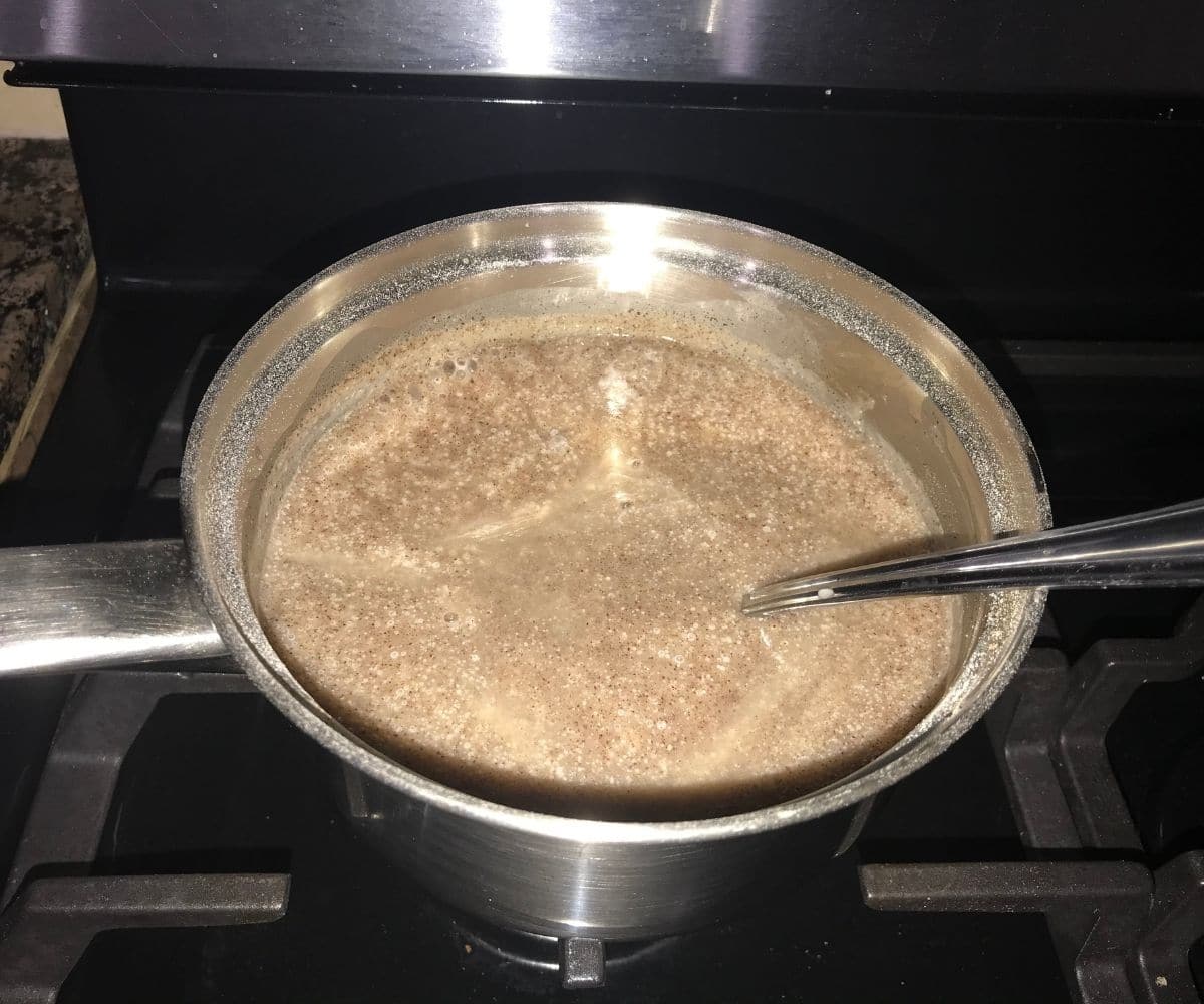 A pan is with finger millet porridge over the heat
