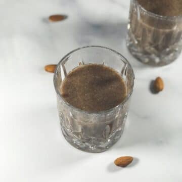 A glass of ragi malt is on the table