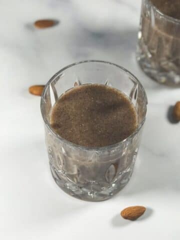 A glass of ragi malt is on the table