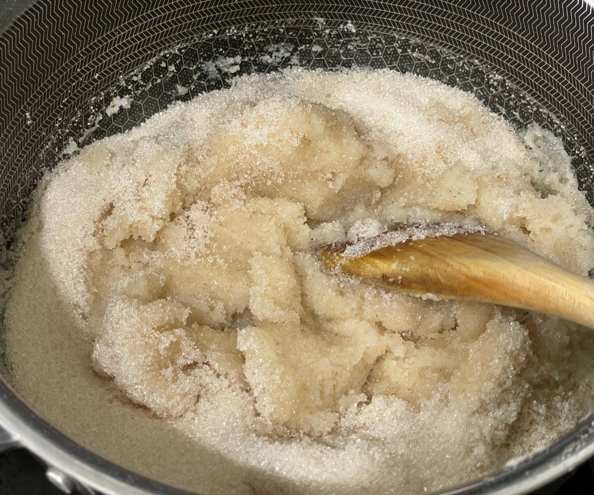 A pan of rava kesari mixture over the flame.