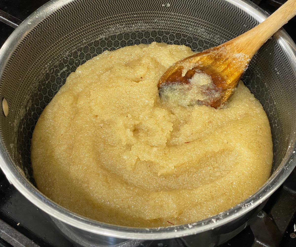 A pan of rava kesari bath is on the flame.