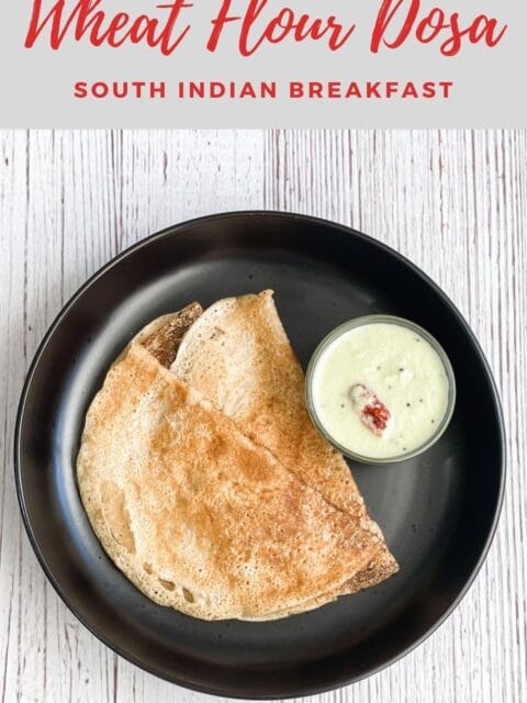Wheat flour dosa is on the plate with chutney.
