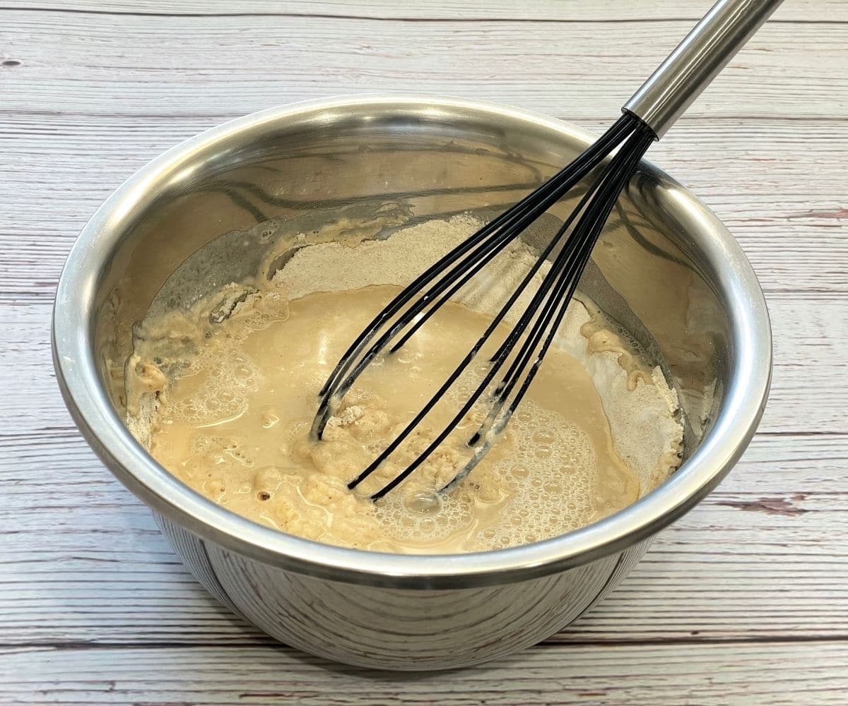 a bowl is with wheat flour dosa batter.