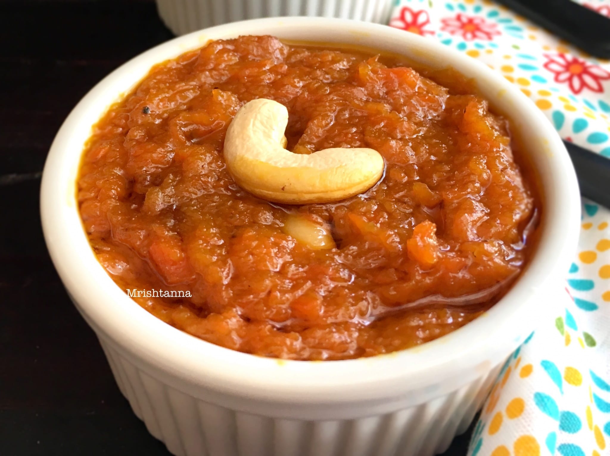 Dairy Free Carrot Halwa A bowl of carrot halwa on a plate