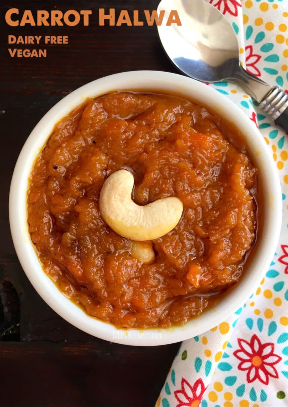 A bowl of food on a plate, with Gajar ka halwa