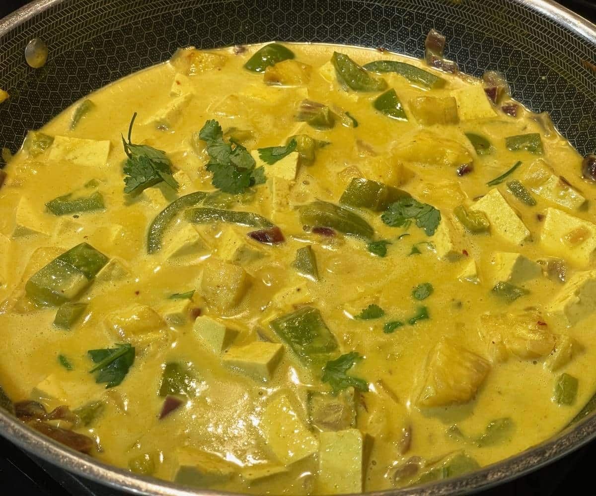 A pan is with Thai pineapple tofu curry.