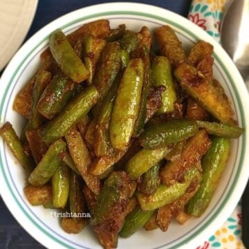 A plate of food on a table, with Ivy gourd