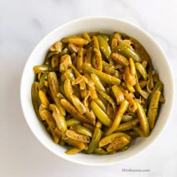 Close up of bowl which is filled with kovakkai fry.