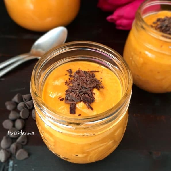 A glass jar is filled with Papaya mousse