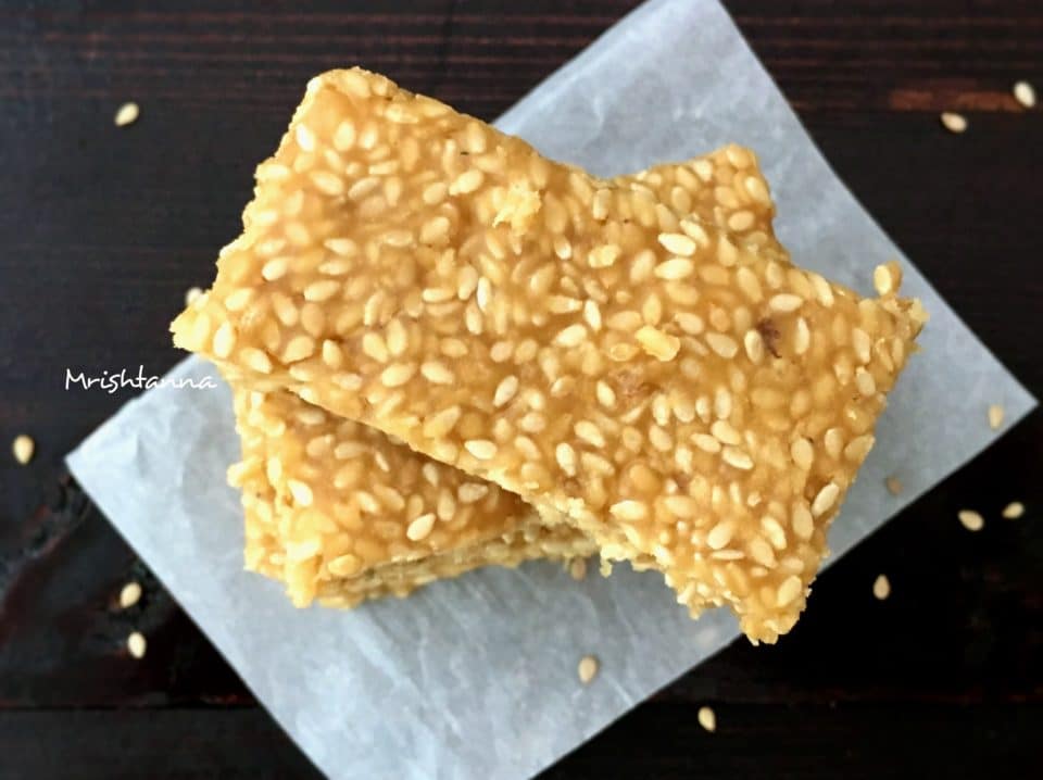 Food on the cutting board, with Sesame and Chikki