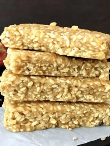 A stack of sesame chikki is on the table.