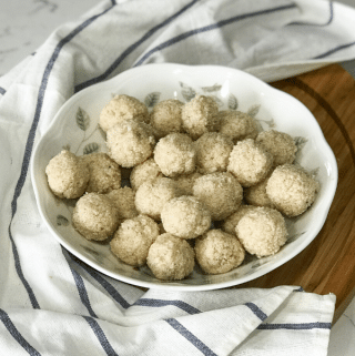 a white plate is full of rava laddu