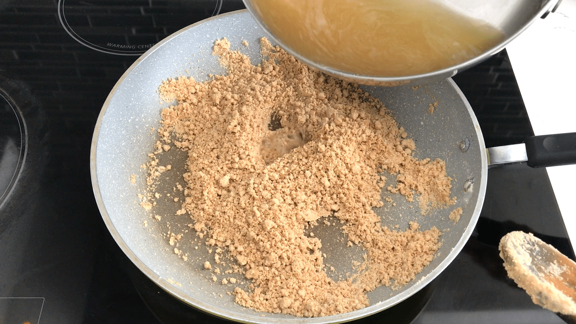 A pan of jaggery on a table, with Wheat flour 