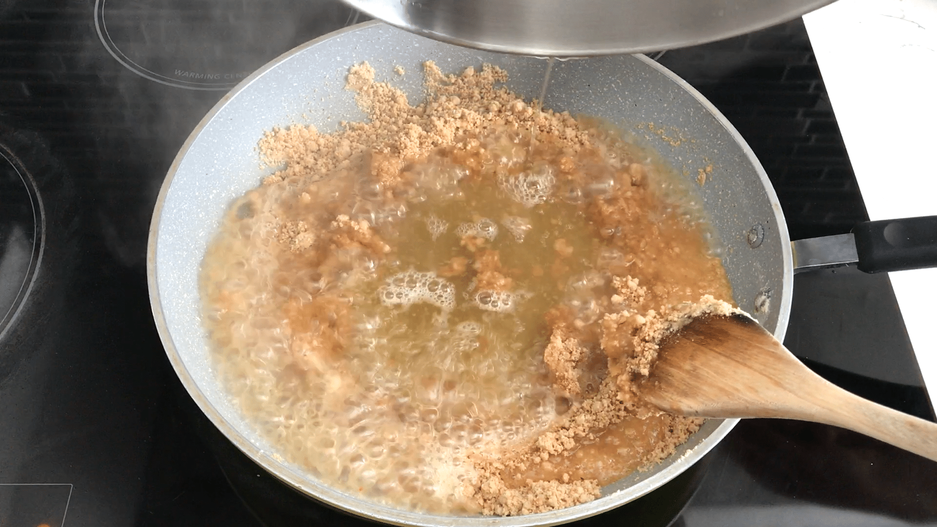 A bowl of food on a stove, with Flour and Wheat