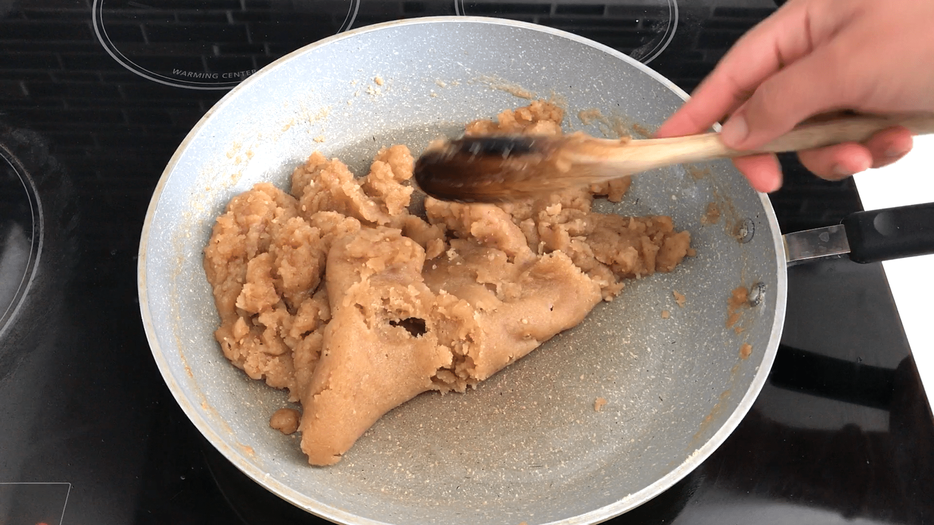 A person cooking food on a plate, with Flour and Wheat