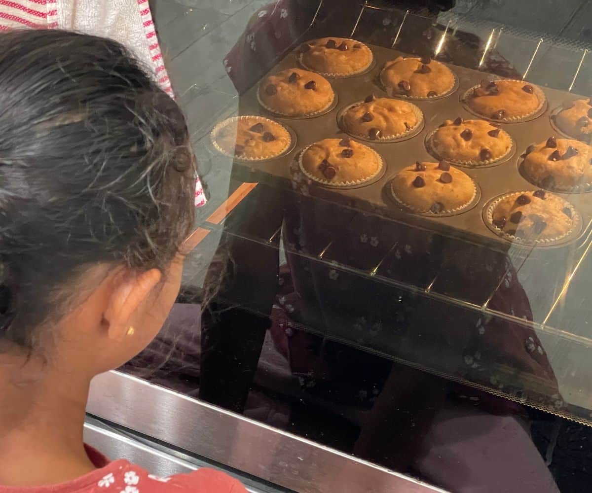 Muffins are baking inside the oven.