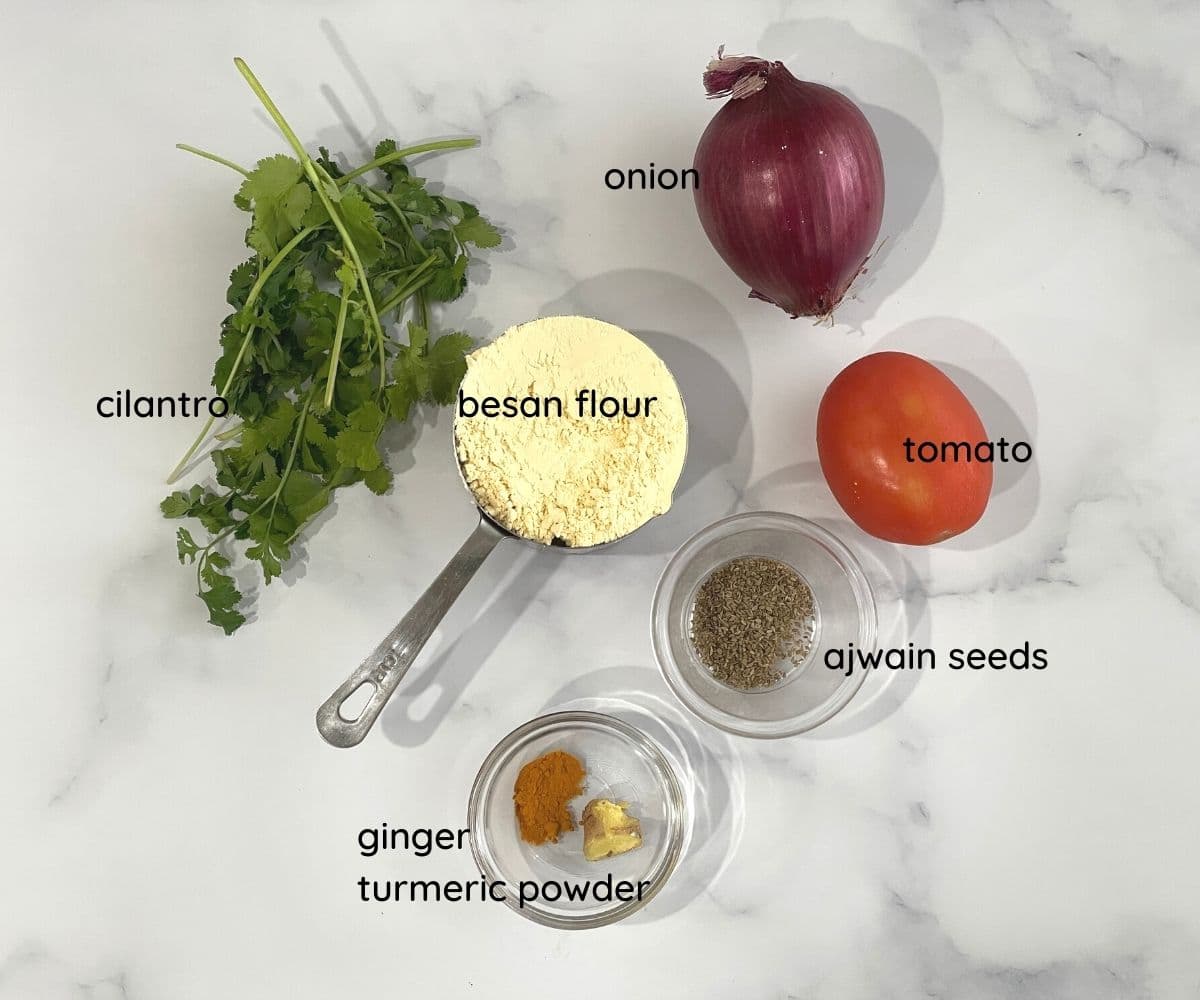 besan chilla recipe ingredients are on the table.