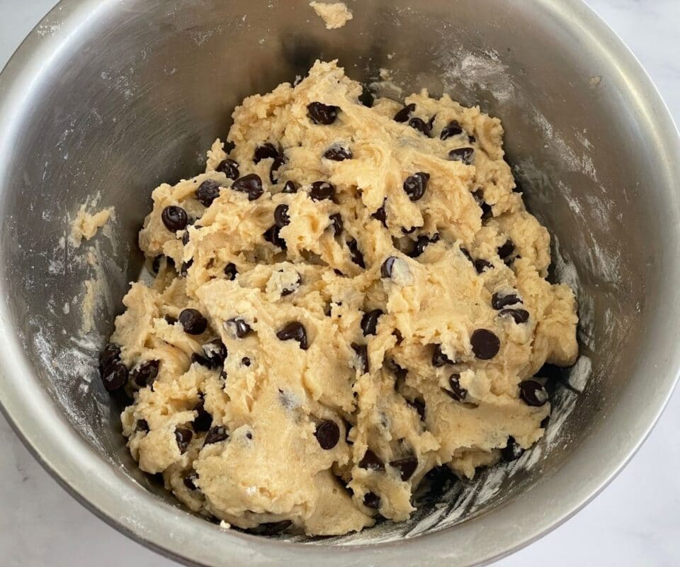 Bowl is with cookie dough and chocolate chips.