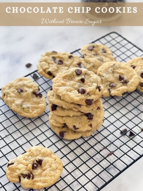 Vegan chocolate chip cookies are on the wire rack.