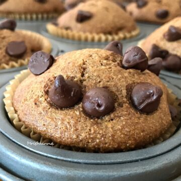A piece of chocolate cake on a plate, with Muffin and Almond butter