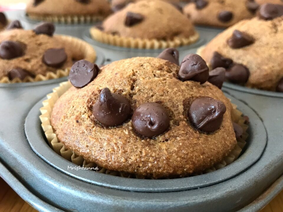 A piece of chocolate cake on a plate, with Muffin and Almond butter