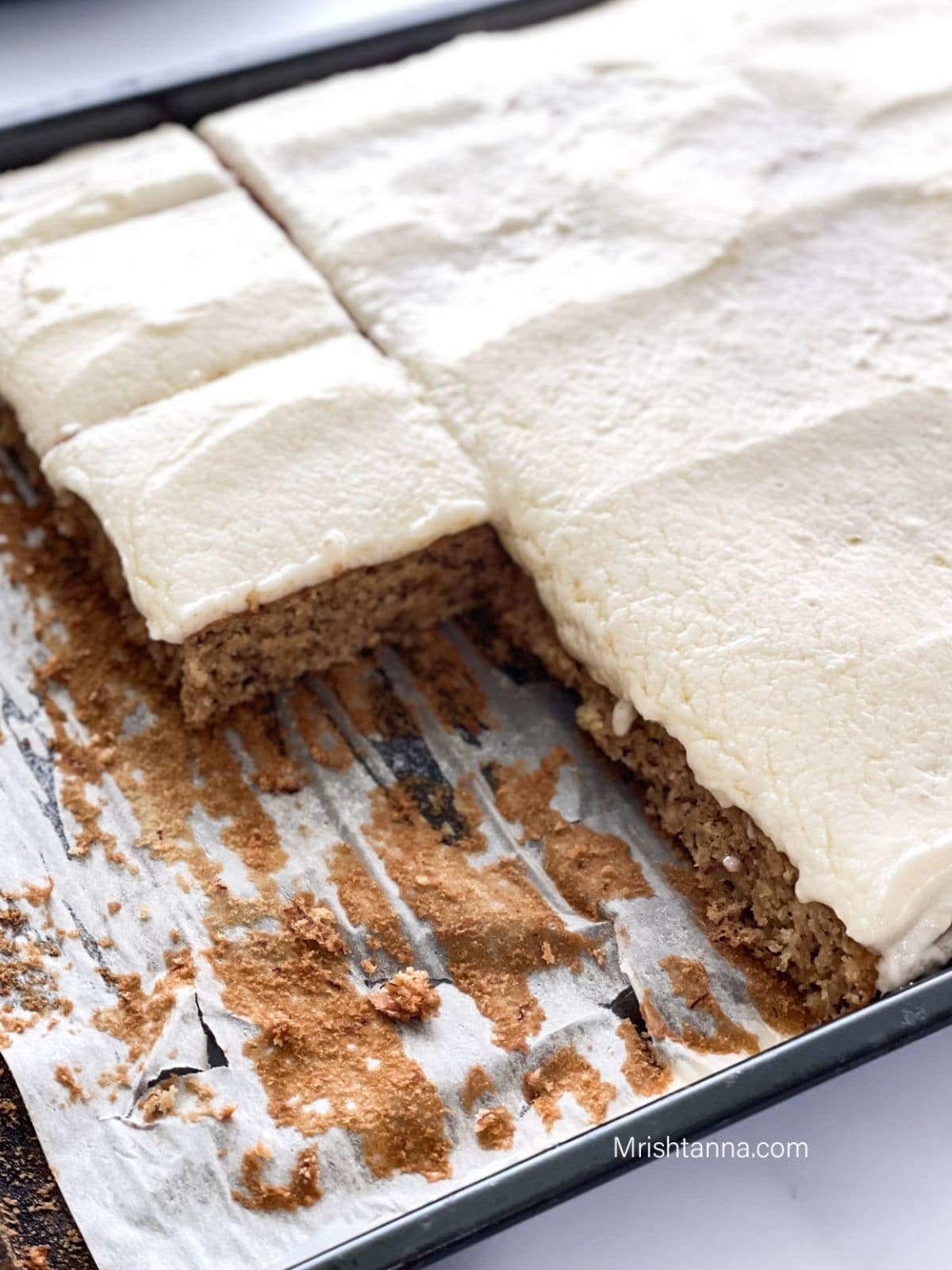 A sheet pan is filled with vegan banana cake and placed on the table