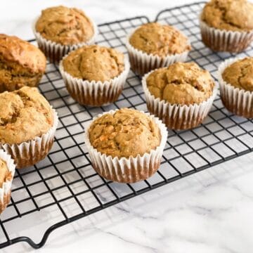 Banana Carrot muffins are placed on the cooling wire rack.