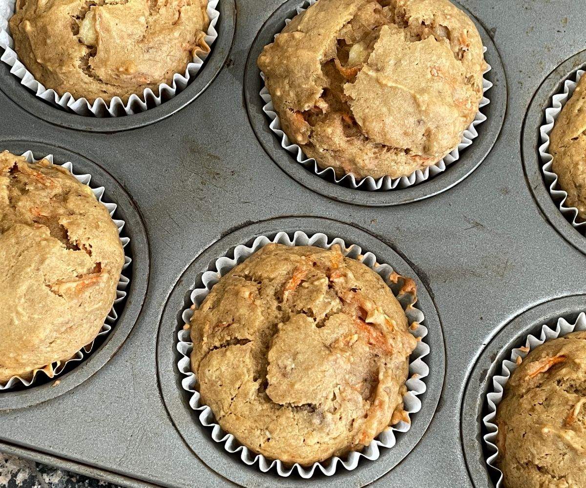 Baked muffins are on the tray.